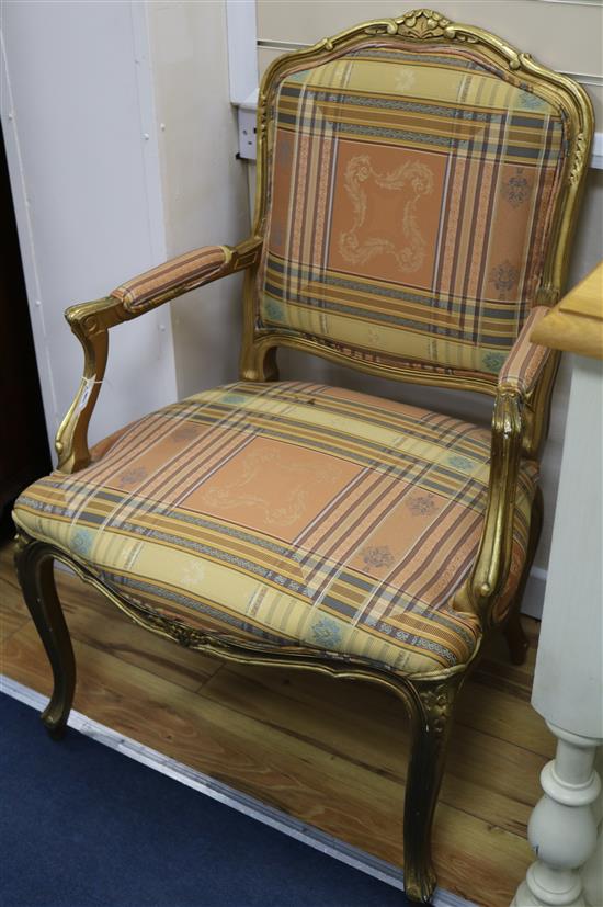 A pair of Louis XV style giltwood fauteuils